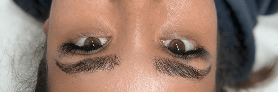 Professional eyebrow treatment showcasing brow lamination and tinting results